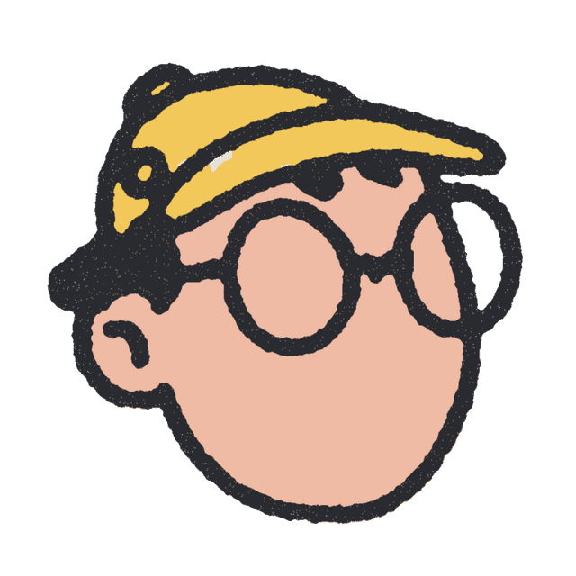 Pascal, in a yellow cap and round glasses